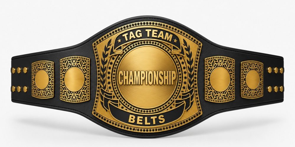 Premium black and gold Tag Team Championship belt with large central “CHAMPIONSHIP BELTS” plate and ornate side plates, displayed on a clean white background in a professional product showcase style.